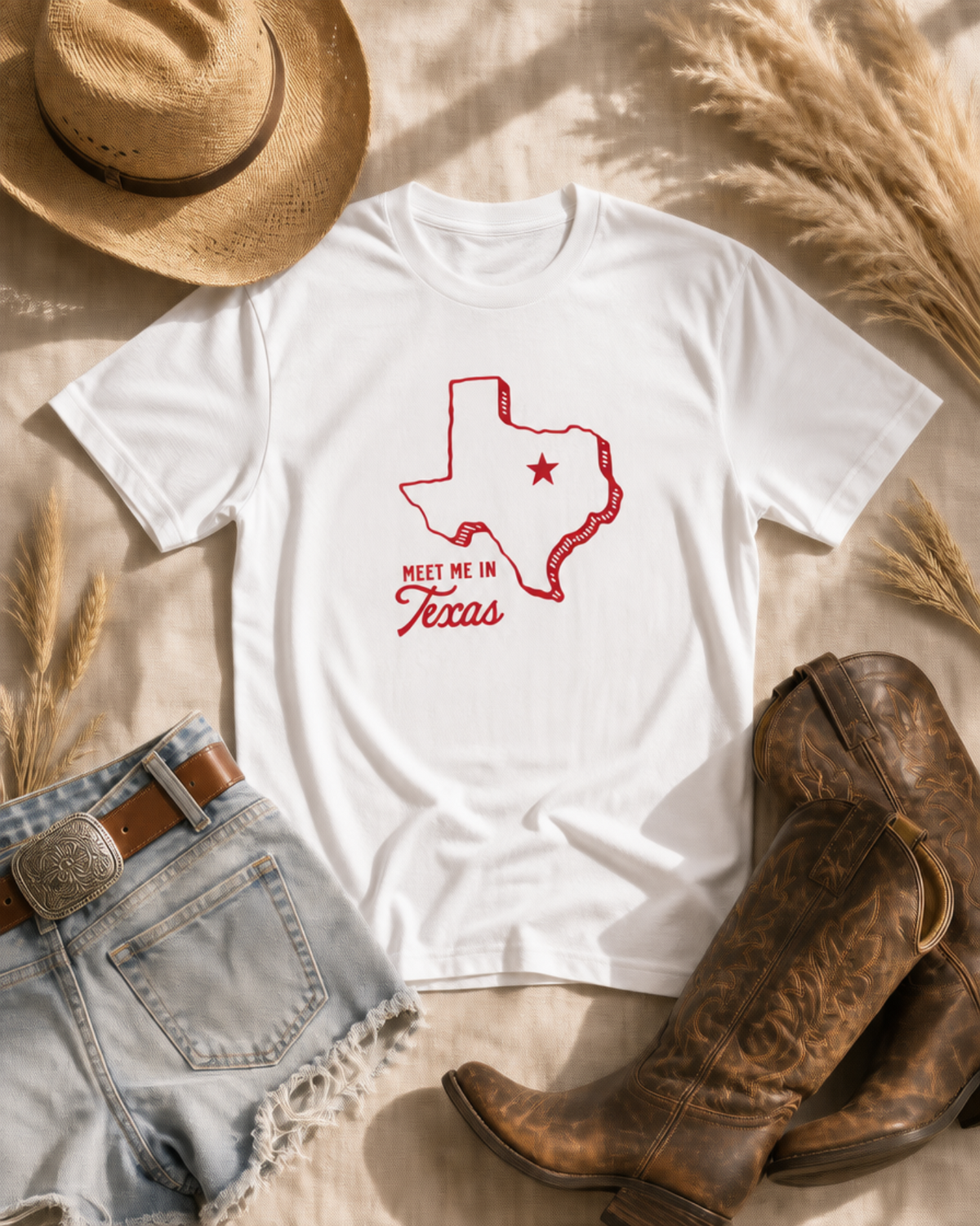 Meet Me in Texas T-Shirt — western flat lay with cowboy hat and boots